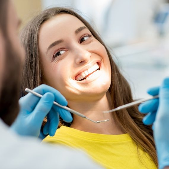 Smiling patient during a cosmetic bonding appointment